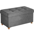 SONGMICS Taburet pliabil cu sezut moale, spatiu de depozitare, maxim 300kg, 76x38x40cm, gri inchis